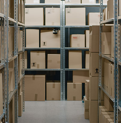 Storage room with cardboard boxes on shelves