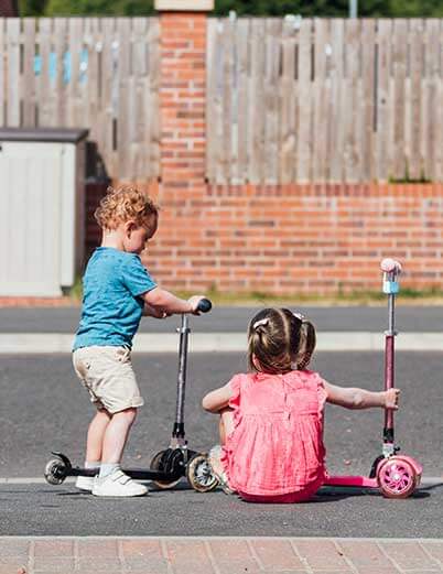 Children playing on scooters