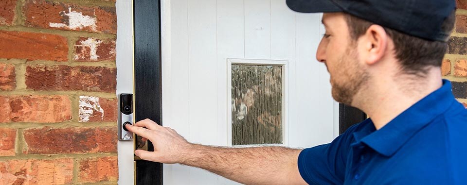 Man ringing video doorbell