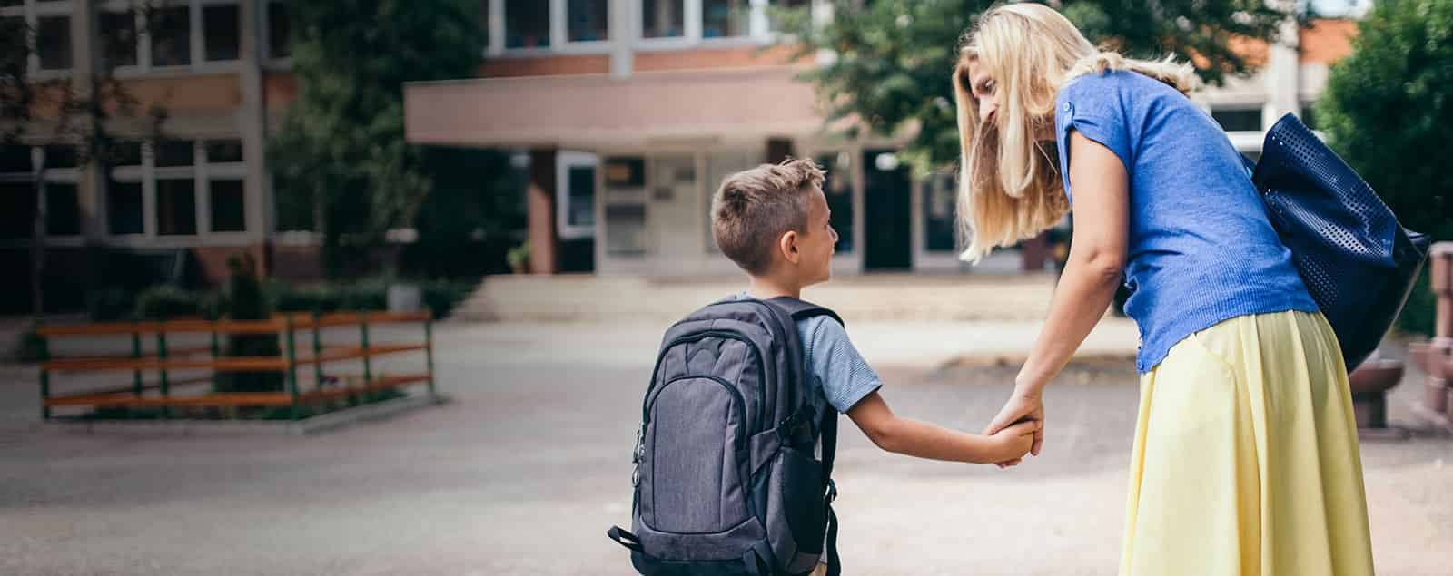 Mother seeing son off to school