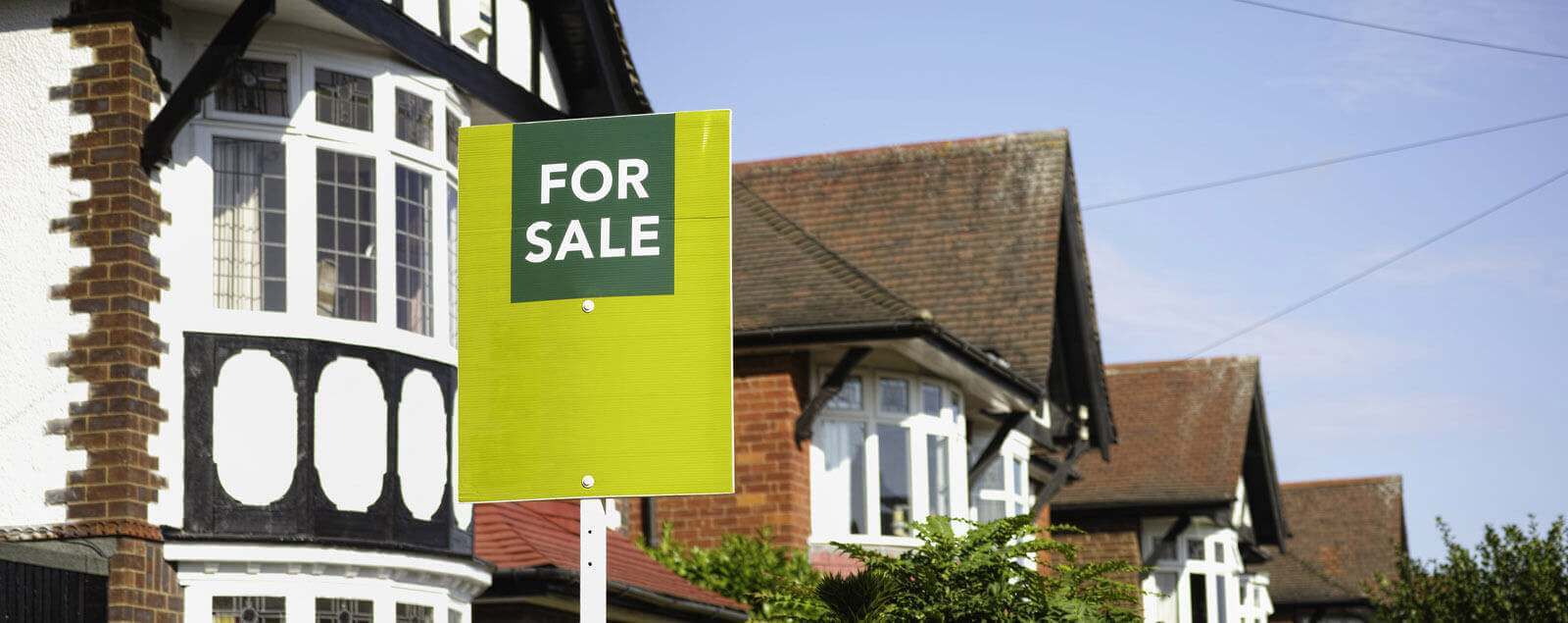 For sale sign outside houses