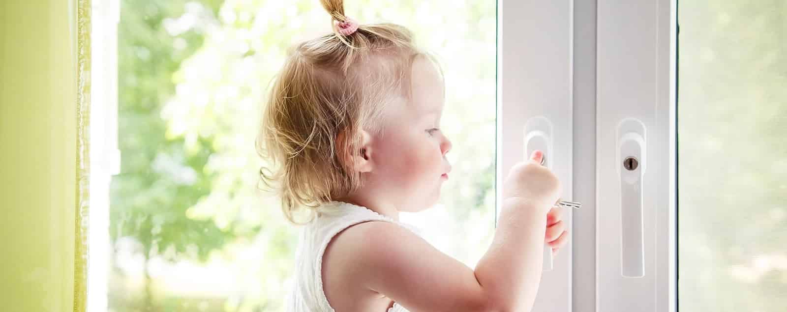 Child opening door with keys