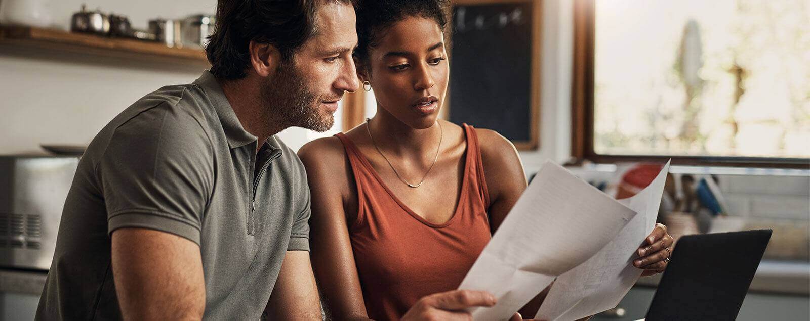 Couple looking over paper documents