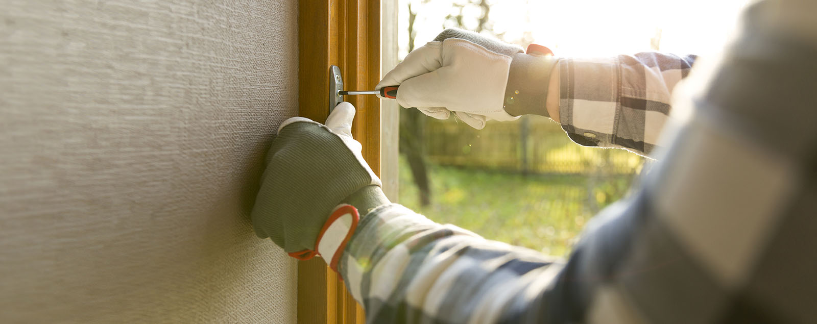 Hands shot of person installing security window