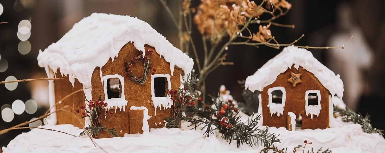 Two gingerbread houses in winter scene