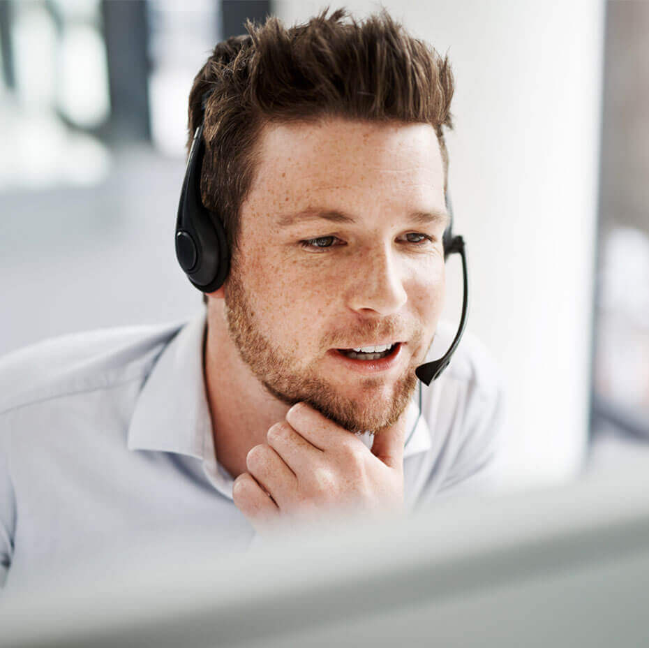 Man in call-centre with headset