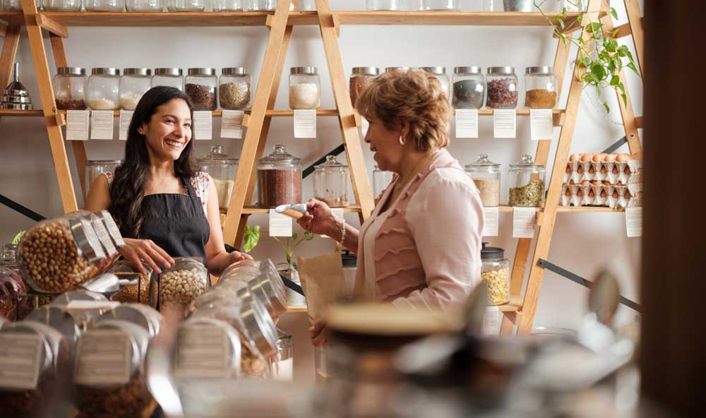 Two ladies smiling in zero waste shop