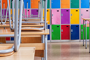 School classroom with desks on chairs