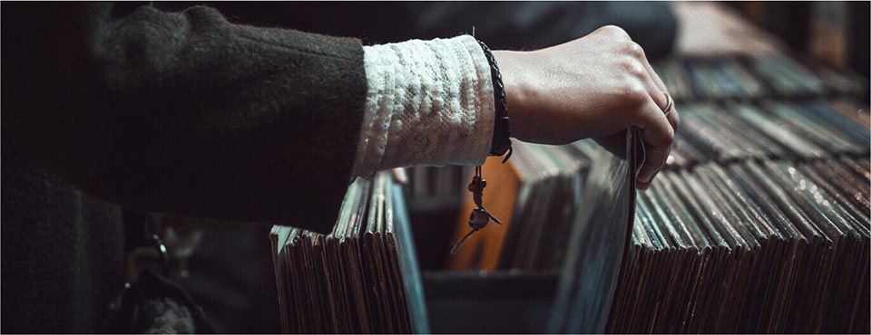Arm shot of person looking through records 