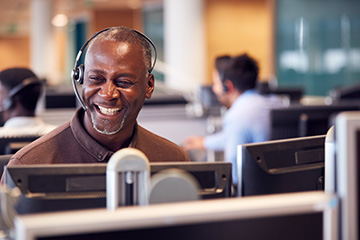 Call centre man laughing