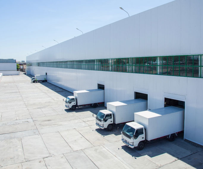 Four lorries in loading bays