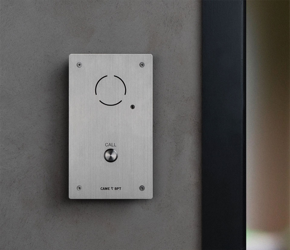 Metal, wall-mounted call button