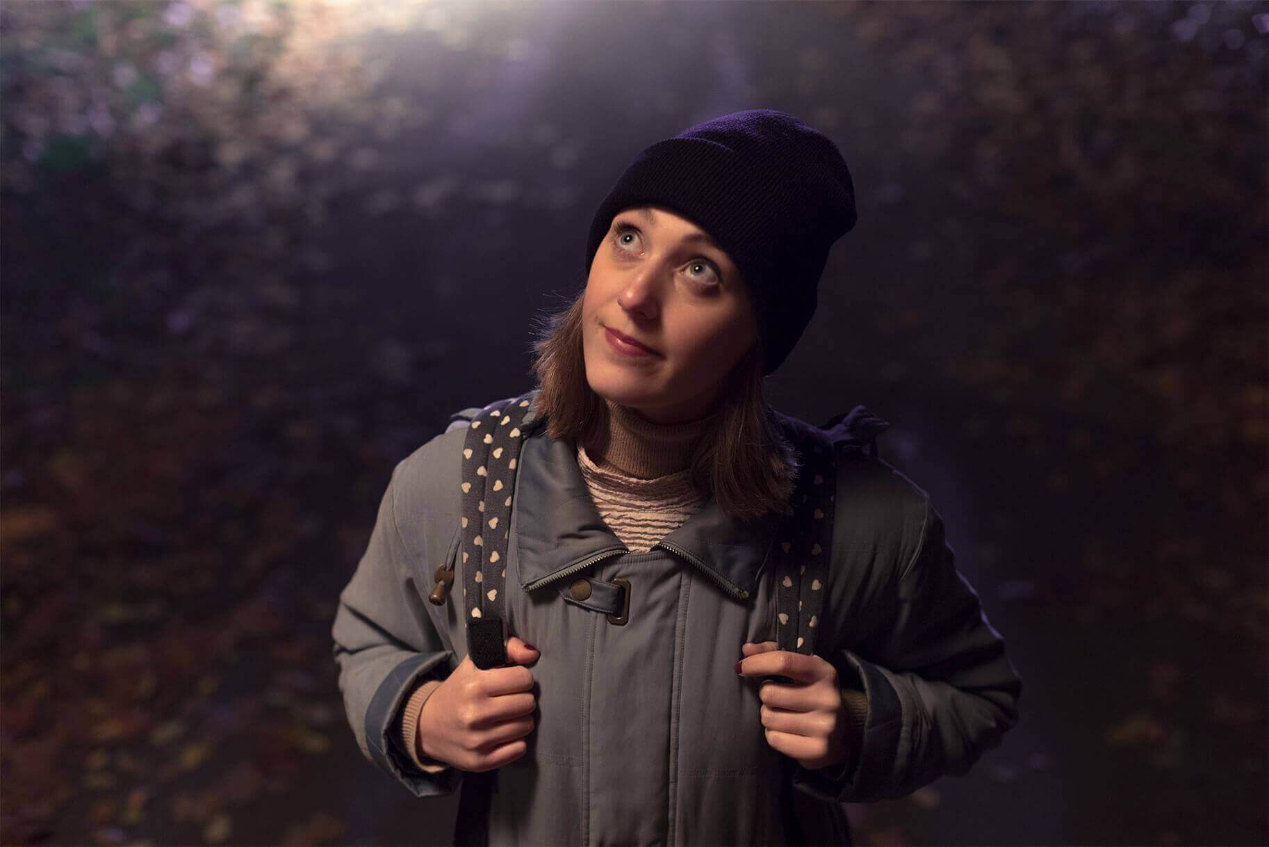 Lady in beanie looking upwards