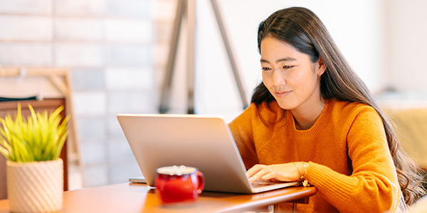 Lady on laptop smiling