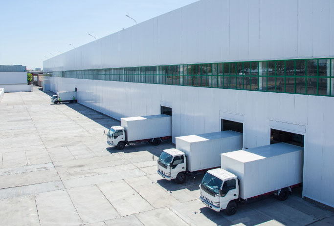 Four lorries in loading bays