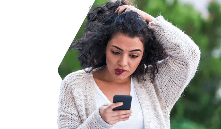 Frustrated lady looking at smartphone